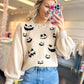 Spooky Smirks Sweater
